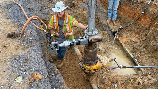 workers on job site for hot tapping project
